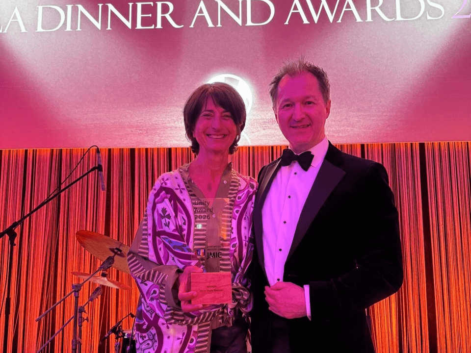 Anne-Marie Baezner Receives 2026 JMIC Unity Award from James Rees
